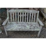 A weathered hardwood garden bench.