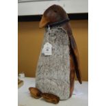 A penguin doorstop.