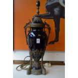 A good pair of blue porcelain and ormolu urn shaped lamps.