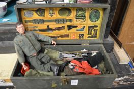 An Action man in original box with accessories.
