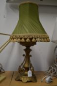 An ornate cast metal lamp.