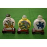 Three Chinese snuff bottles.