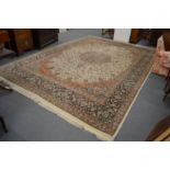 A good large Persian design carpet, cream ground with stylised floral decoration within similar