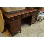 A Victorian walnut pedestal desk.