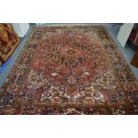 A good Persian design carpet, red ground with all over stylised decoration 325cm x 235cm.