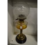 Brass and glass oil lamp.