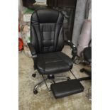 A good office swivel armchair with leg rest.