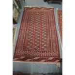 A Persian Bokhara rug 165cm x 95cm.