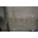 A pair of cut glass decanters and other glassware.
