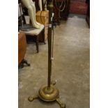 A brass floor standing lamp.