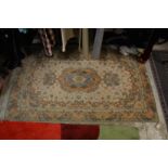 A good small Persian part silk rug, cream ground with floral decoration 160cm x 100cm.