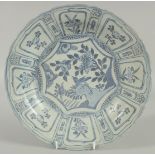 AN 18TH CENTURY NANKING CARGO BLUE AND WHITE DISH, decorated with a central panel of a bird and