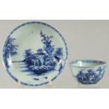 AN 18TH CENTURY NANKING CARGO BLUE AND WHITE PORCELAIN CUP AND SAUCER DISH, with applied