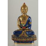 A NEPALESE ENAMELLED BRASS BUDDHA, 20cm high.