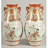 A FINE PAIR OF JAPANESE KUTANI PORCELAIN TWIN HANDLE VASES, painted with a continuous scene