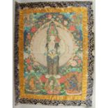 A TIBETAN THANGKA ON SILK.