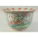 A CHINESE FAMILLE ROSE PORCELAIN JARDINIERE, painted with colourful panels of exotic birds,
