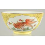 A CHINESE YELLOW GROUND PORCELAIN BOWL, painted with coral red fish with gilt highlights, 12cm