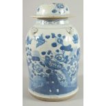 A LARGE CHINESE BLUE AND WHITE PORCELAIN LAMP STAND JAR AND COVER, painted with birds and native