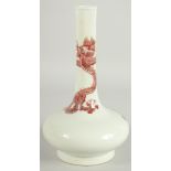 A CHINESE COPPER RED AND WHITE PORCELAIN BOTTLE VASE, the neck with coiled dragon, six-character