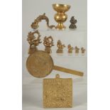 A COLLECTION OF SEVEN BRASS OPIUM WEIGHTS, together with four other brass items, (11).