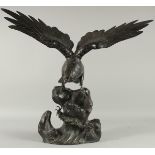 AN IMPRESSIVE JAPANESE SECTIONAL BRONZE STATUE OF AN EAGLE, with wings outstretched, stood upon a