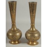 A PAIR OF QAJAR ENGRAVED BRASS BOTTLE VASES, decorated with various panels of birds and flora,