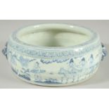 A CHINESE BLUE AND WHITE PORCELAIN BOWL, with moulded twin handles and decorated with figures,