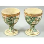 A PAIR OF JAPANESE SATSUMA EGG CUPS, with foliate decoration, 6.5cm high.