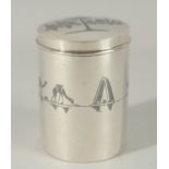 A FINE IRAQI NIELLO INLAID SILVER LIDDED CYLINDRICAL BOX; possibly a tea caddy, 9cm high.