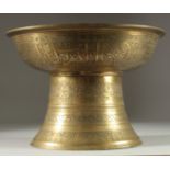 A RARE EARLY ISLAMIC MAMLUK SILVER INLAID BRASS FOOTED BOWL / TRAY STAND, with engraved panels of