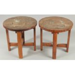 A PAIR OF BONE INLAID WOODEN STOOLS, each depicting a female figure carrying a vessel of water, 30cm