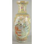 A LARGE CHINESE FAMILLE JAUNE PORCELAIN VASE, painted with two large panels of figures and smaller