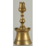 A RARE 16TH-17TH CENTURY OTTOMAN TURKISH BRASS TULIP CANDLESTICK, 23cm high.