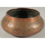 AN EGYPTIAN ENGRAVED COPPER BOWL, 17cm diameter.