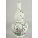 A CHINESE FAMILLE ROSE PORCELAIN DOUBLE GOURD VASE, decorated with cranes and peach blossom, base