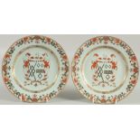 A PAIR OF CHINESE EXPORT ARMORIAL PORCELAIN PLATES, finely painted with central coat of arms with