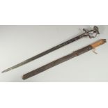 A FINE 18TH CENTURY INDIAN TULWAR SWORD WITH SILVER INLAID HILT, sheathed within a leather