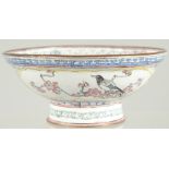 A 19TH CENTURY CHINESE CANTON ENAMEL BOWL, painted with panels of birds and native flora, 13cm