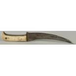 AN 18TH-19TH CENTURY MUGHAL INDIAN BONE HILTED PESH KABZ DAGGER, 28cm long.