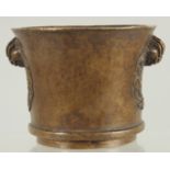 A CHINESE BRONZE TWIN HANDLE CENSER, 8.5cm high.