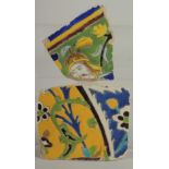 TWO 17TH CENTURY PERSIAN SAFAVID CUERDA SECA TILE FRAGMENTS, 15cm x 13cm and 12.5cm x 13cm.