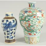 TWO CHINESE PORCELAIN VASES; one 19th century blue and white phioenix vase, the other a wucai dragon