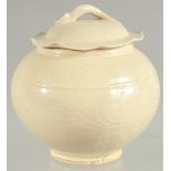 A CHINESE DING WARE PORCELAIN JAR AND COVER, 12cm high.