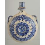 A 19TH CENTURY MOROCCAN POTTERY PILGRIM WATER FLASK, 21.5cm high.