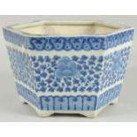 A 19TH CENTURY CHINESE BLUE AND WHITE HEXAGONAL JARDINIERE, painted with foliate decoration, (one