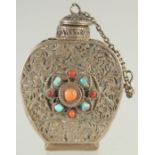 A SMALL FILIGREE SNUFF BOTTLE WITH INSET CORAL AND TURQUOISE STONES, 5cm high.