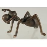 A BRONZE FIGURE OF AN ANT.