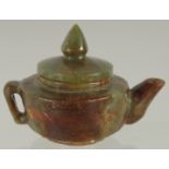 A CHINESE CARVED JADE MINIATURE TEAPOT, 9cm wide (spout to handle).