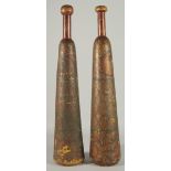 A RARE PAIR OF 19TH CENTURY PERSIAN QAJAR LACQUERED WOODEN EXERCISE CLUBS, 62cm long.